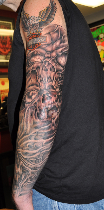 Tattoo of skulls on arm 