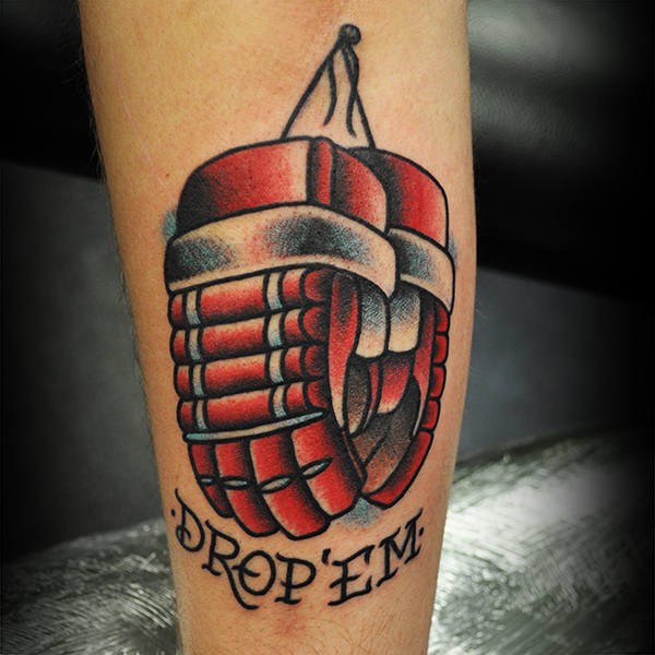 A tattoo of Red Hockey Gloves and the words "Drop 'Em" by Steve Fawley 