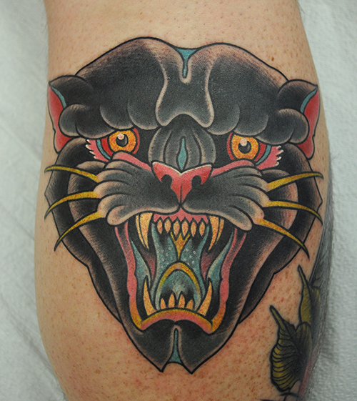 panther head on the back of a calf 